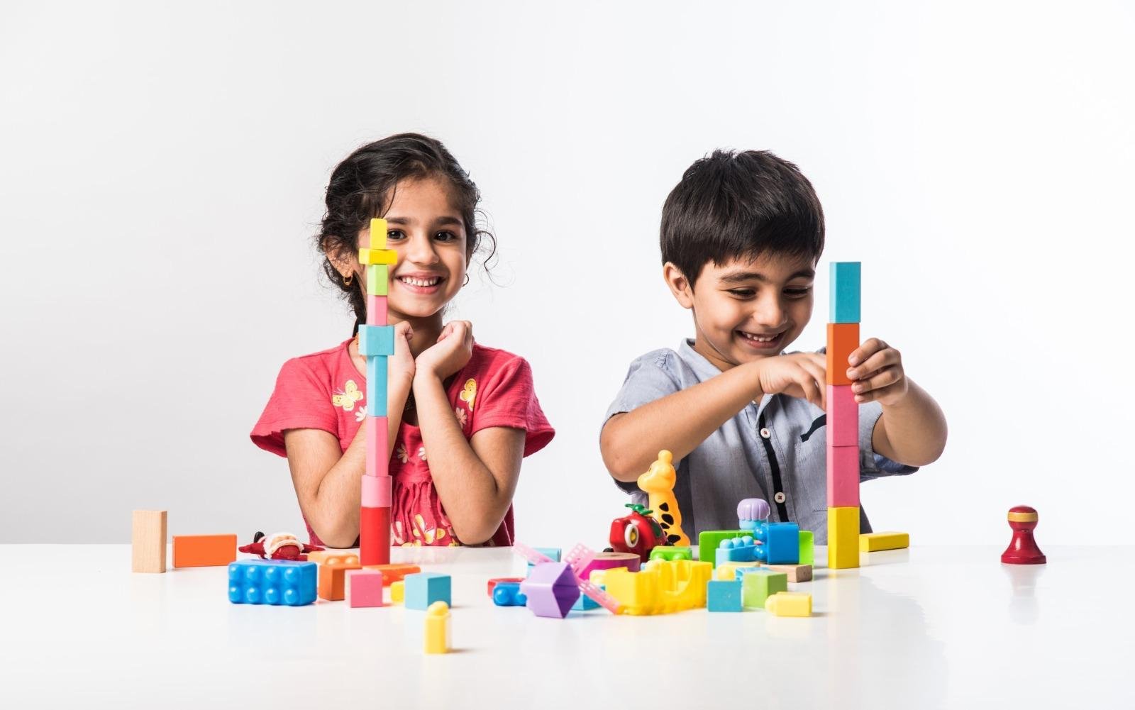 Two children building together